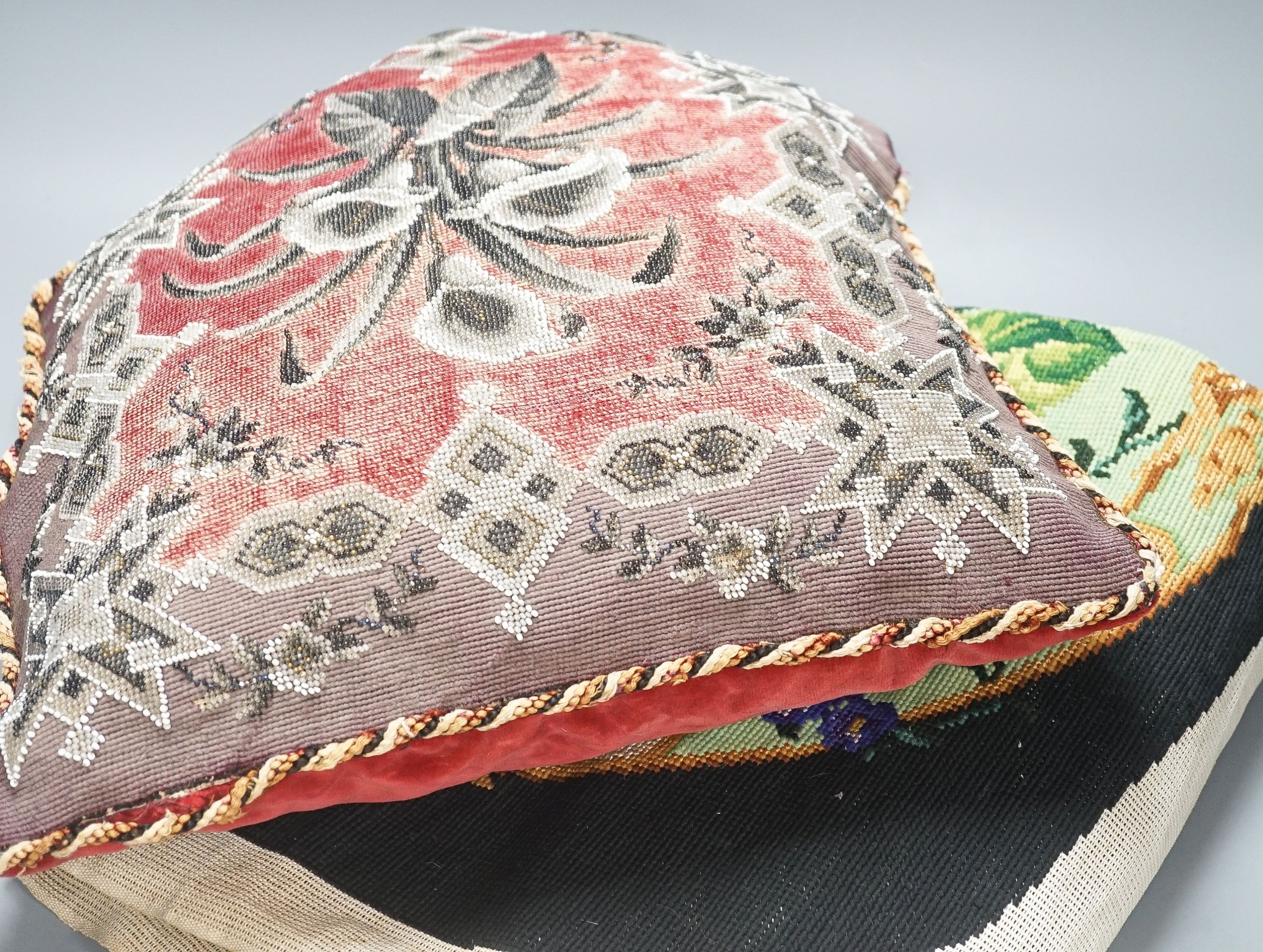 A 19th century wool worked chair seat and back and a 19th century Berlin bead worked cushion